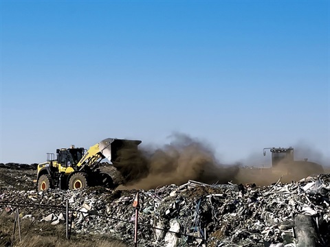 Cooma Landfill in the spring 2024 extreme winds, with landfill soil flying on the breeze around the machinery.