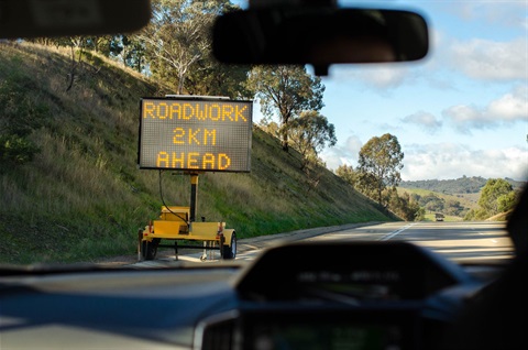 Roadworks VMS board sign on the side of a regional road