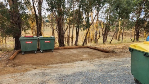 Photo of the site of new Smiths Road/The Angle waste facility, with two plastic skip bins in place