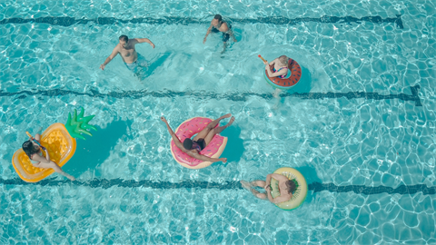 People floating in pool 